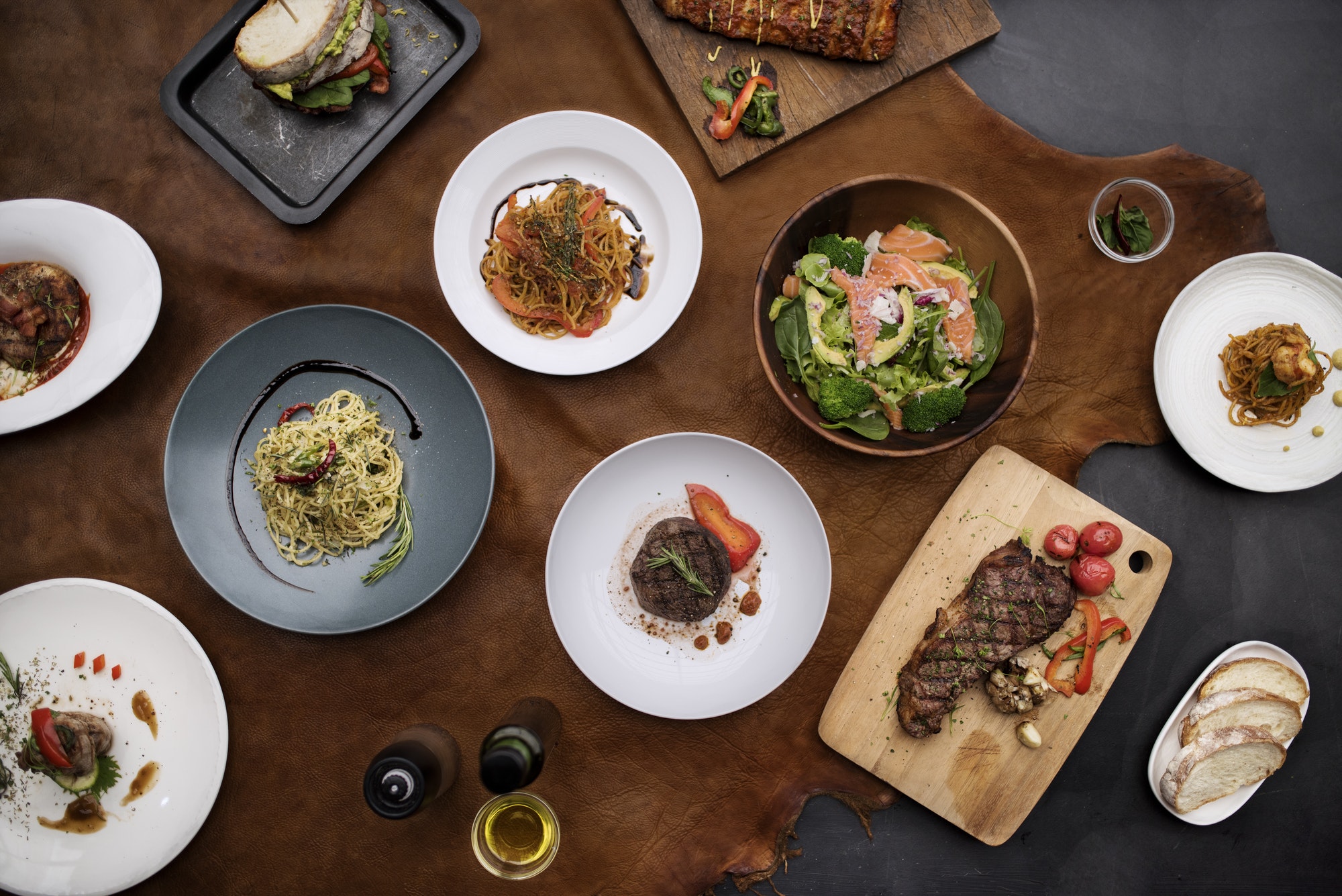 Mixed italian food plates on table